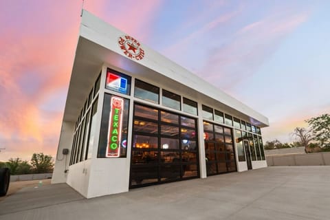 Front Exterior - Neon Lights, Vintage Gas Pump Decor & Large Glass Windows!