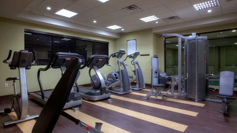 Stay on track with your fitness routine in our well-equipped gym, featuring modern cardio machines.