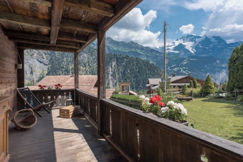 Private balcony with outdoor seating and beautiful views of the surrounding mountains.
