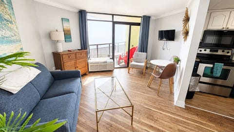 Settle into your coastal retreat, where ocean views, comfortable seating, and a bright, open living space invite you to unwind together after a day on the beach or enjoy a quiet morning before your next Myrtle Beach adventure.