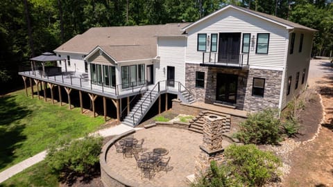 Backyard | Spacious Patio | Outdoor Seating & Stone Fireplace