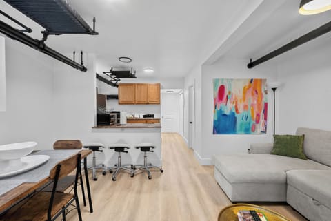 Bright open-concept living space with breakfast bar and modern style