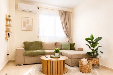 Natural light fills the living room throughout the day, creating a warm and inviting atmosphere. The comfortable seating area is perfect for relaxing with a coffee, reading a book or watching your favourite shows