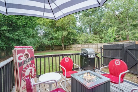 Private fenced deck with fire table, grill, and fun Alabama-themed seating
