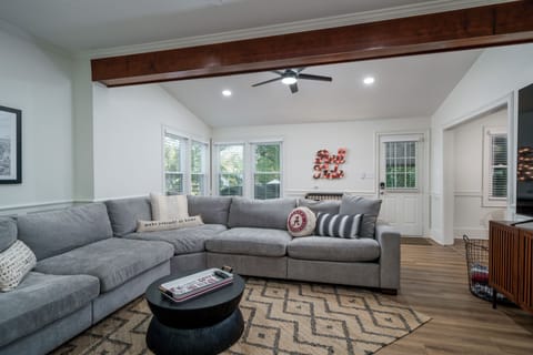 Bright, cozy living room with oversized sectional and stylish decor