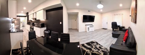  Living Room: Sofa bed, desk, 65” Smart TV, blackout curtains & smoke alarm.