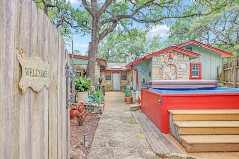 Welcome to Hillsedge Haciendas - La Casita. A charming stone cottage with a private courtyard awaits, complete with a hot tub nestled under mature oak trees.