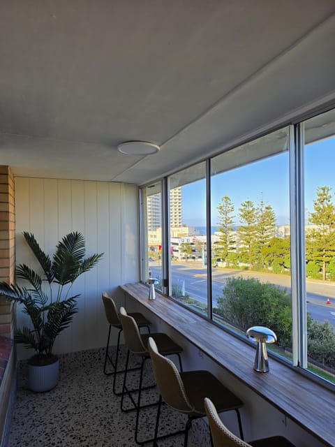 Sunny window-side breakfast bar with bright views and relaxed seating