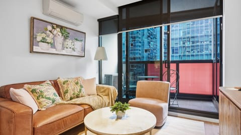 Unwind in the cosy lounge with floor-to-ceiling windows and city views.