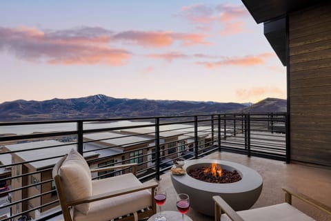 Watch stunning sunsets on the deck, complete with a warm fire pit and lounge chairs overlooking the Jordanelle Reservoir. (Serenity Now)