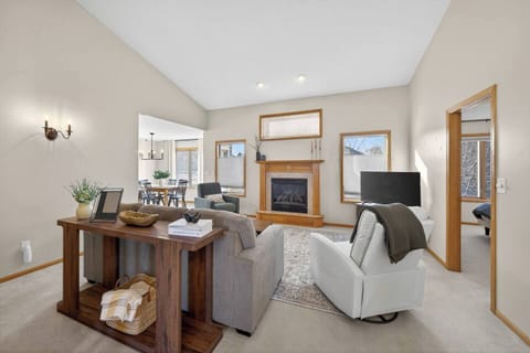 Gather around the cozy gas fireplace, settle into one of the two recliners, and enjoy your favorite shows on the Smart TV. It’s the perfect place to relax and reconnect.