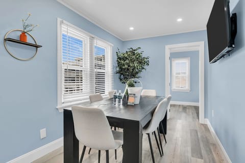 Bright, stylish dining space with seating for four and sunny windows