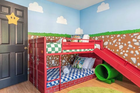 A playful adventure awaits in this Mario-inspired bedroom, where friends and family can enjoy a fun and unique stay.