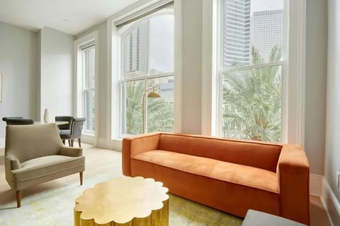Spacious living room with comfortable seating and a TV.