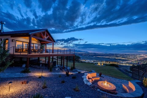 Gather around the fire pit as the sun sets over the valley and downtown SLC.