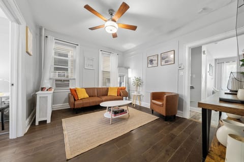 Bright modern living room with leather seating and natural light