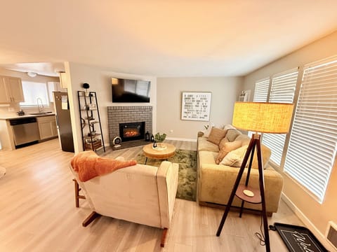 Relax in our spacious Living Room with 55 inch smart TV and electric fireplace.