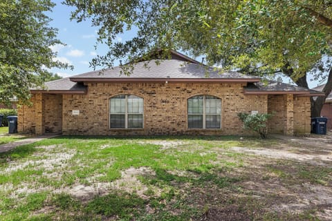 Charming brick home with shaded yard and welcoming curb appeal