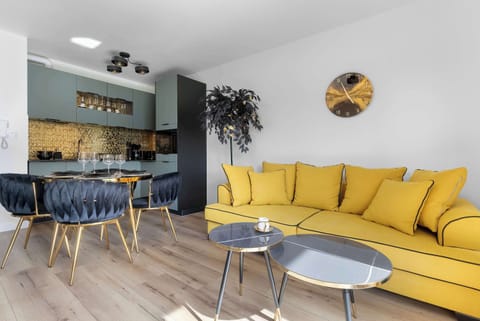 Relax in the stylish living room with a comfortable sofa and modern decor.