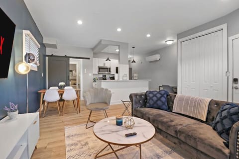Make yourself at home in this stylish living room! Enjoy the smart TV, relax on the comfortable couch, get some work done at the dedicated workspace with high-speed WiFi, or have some fun with the games provided.