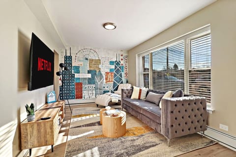 Living room with adjustable lighting, perfect for movie nights or game nights.