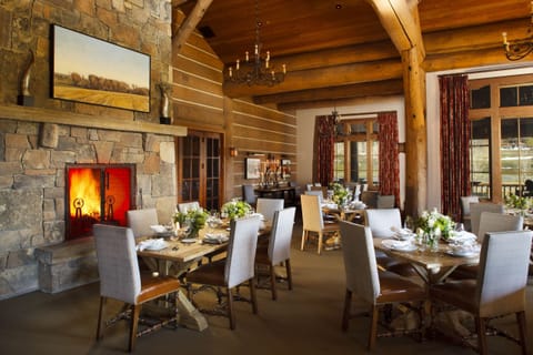 Fireplace-warmed dining room inside the 26,000 sq ft clubhouse — Engelmann's Bistro is steps away