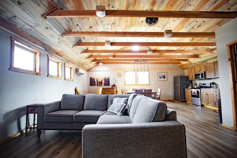 Great room with a comfortable couch to curl up on and enjoy a movie. 