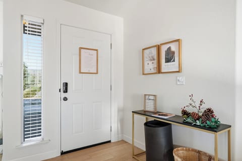Bright, welcoming entryway with stylish decor and natural light