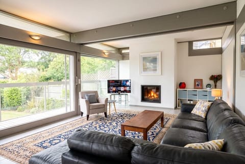 Sink into leather sofas by the fire with Netflix and countryside views
