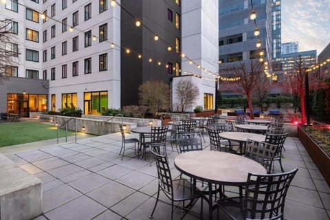 Outdoor courtyard with city views and patio seating