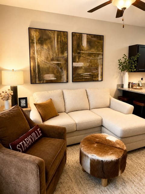Relax in our cozy living room featuring a 55" Smart TV.