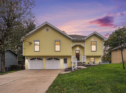 Beautiful sunset front view showcasing the home's warm charm and curb appeal.