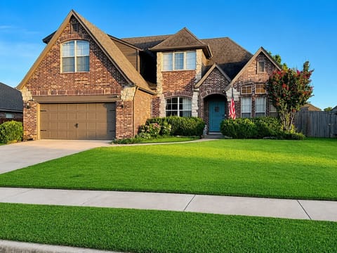 Stunning brick estate with timeless curb appeal and elegance.
