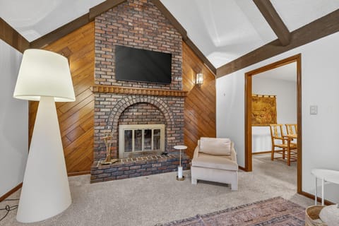 Cozy fireplace lounge with rustic accents and comfortable seating.