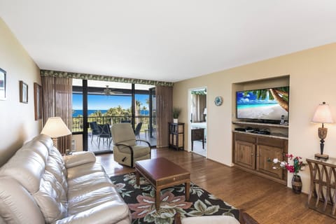 Sink into plush furnishings while gazing at stunning ocean vistas through floor-to-ceiling glass. Your private balcony awaits morning coffee moments, and a large TV makes evenings just as inviting.