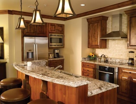 Spacious gourmet kitchen with granite island and stylish bar seating