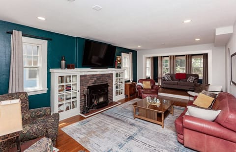 Large, comfy living room with plenty of seating plus a full sofa bed.