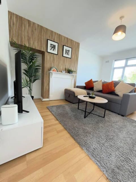 Bright and welcoming living room, perfect for unwinding after a busy day. Relax on comfortable sofas and enjoy the large Smart TV with streaming access. Warm décor and soft lighting create a cosy, homely space to relax, recharge and feel at ease.