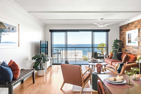 Spacious balcony with panoramic ocean views stretching towards Bribie Island