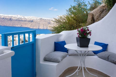 Private terrace with outdoor seating and caldera views