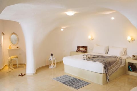 Spacious cave-style bedroom with a comfortable queen bed