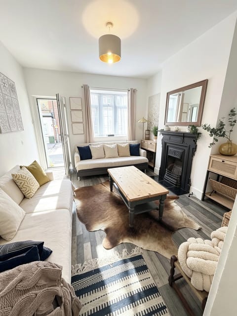 nice cosy front room with two sofa’s that turn into single beds, A Tv on wall 