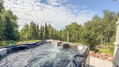 Soak away your cares in the outdoor hot tub surrounded by lush forest views and fresh mountain air under big, open skies.