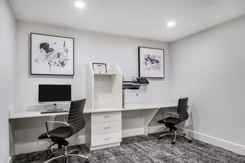Business center with workstations, printer, and 24-hour access for all guests