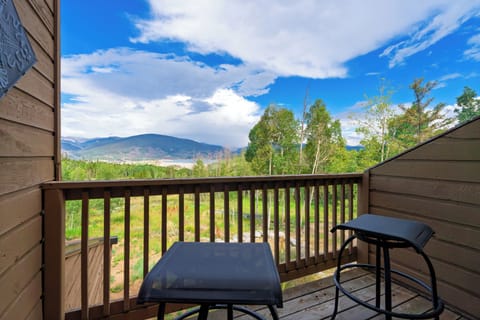 Private balcony with panoramic alpine scenery.