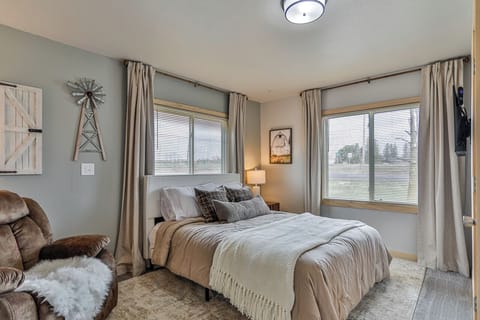 Bright and stylish bedroom featuring plush linens, and a peaceful vibe.