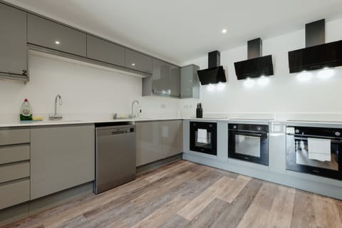 The spacious open plan kitchen and living area includes three cookers and two refrigerators
