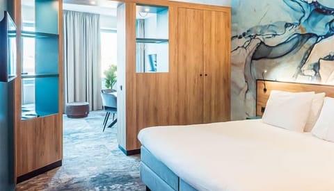 Wake up in a stylish bedroom with airy, open flow.
