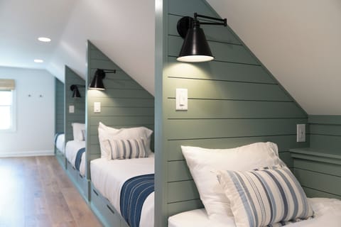 The loft features 4 cozy built-in twin XL beds with storage drawers, reading lights, and charging ports, and a dedicated HVAC unit. Great for when you want to be together, but don't want to share a bed!