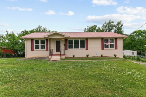 Welcome to Dugan Cottage—your cozy home away from home in Birmingham, featuring a charming brick exterior, easy access, and a peaceful residential setting.